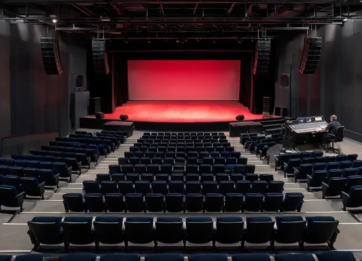 Venue audience listening to a professional Electro-Voice sound system
