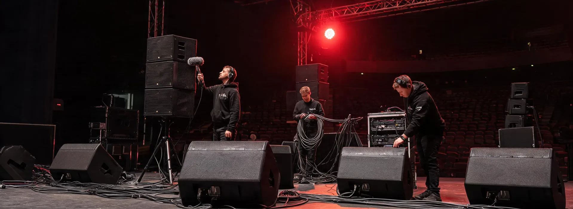 Audio crew preparing Electro-Voice loudspeaker system for venue use